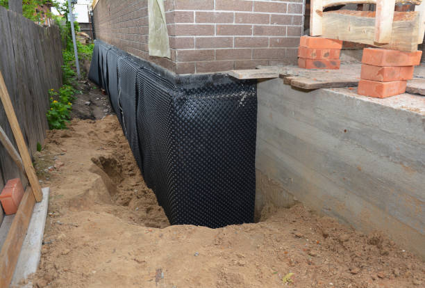 Happy homeowners after waterproofing job in McComb